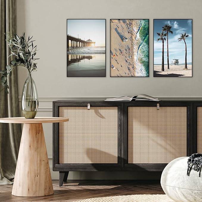 Three picture frames mounted above console