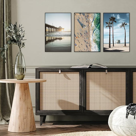 Three picture frames mounted above console