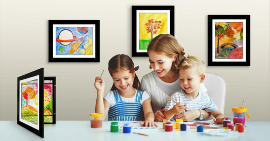 Mother and children painting together with displayed artwork.