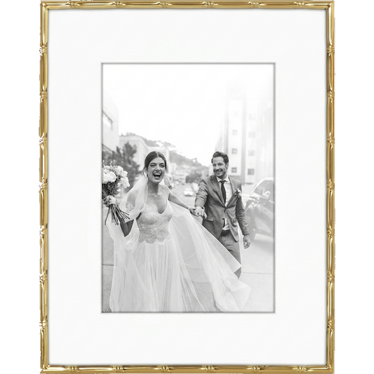 Gold bamboo-style Memento frame with a wide white mat, holding a black-and-white wedding photo #flat