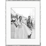 Silver bamboo-style Memento frame with a narrow white mat, holding a wedding photo with a bouquet 
