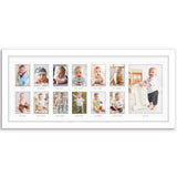White keepsake frame with a wide mat of thirteen labelled monthly baby photos 