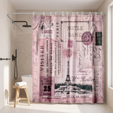 Pink Paris postcard shower curtain, the Eiffel Tower and stamps in a walk-in shower beside a black rain head and stool 