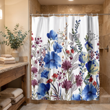 Floral shower curtain of blue, purple and red blooms in a wood and stone bathroom beside folded towels 