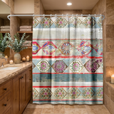 Boho shower curtain of ornate mandala diamonds in red and teal in a wood and stone bathroom beside folded towels 