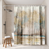 Shower curtain of a misty gold and teal woodland in a walk-in shower beside a black rain head and stool 