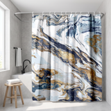 Abstract shower curtain of navy, gold and white marbled swirls in a walk-in shower beside a black rain head and stool 