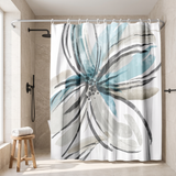 Shower curtain with a large brushed flower in teal and grey in a walk-in shower beside a black rain head and stool 