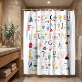 Shower curtain printed with a hand drawn A to Z alphabet chart in a wood and stone bathroom beside folded towels 