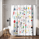Shower curtain printed with a hand drawn A to Z alphabet chart in a walk-in shower beside a black rain head and stool 