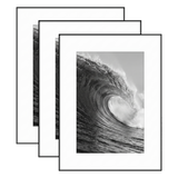 Three black 12x16 frames stacked, white mat opening to 8x12, a barrelling wave 
