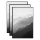 Three black 12x18 frames stacked, layered mountain ridges fading into mist 