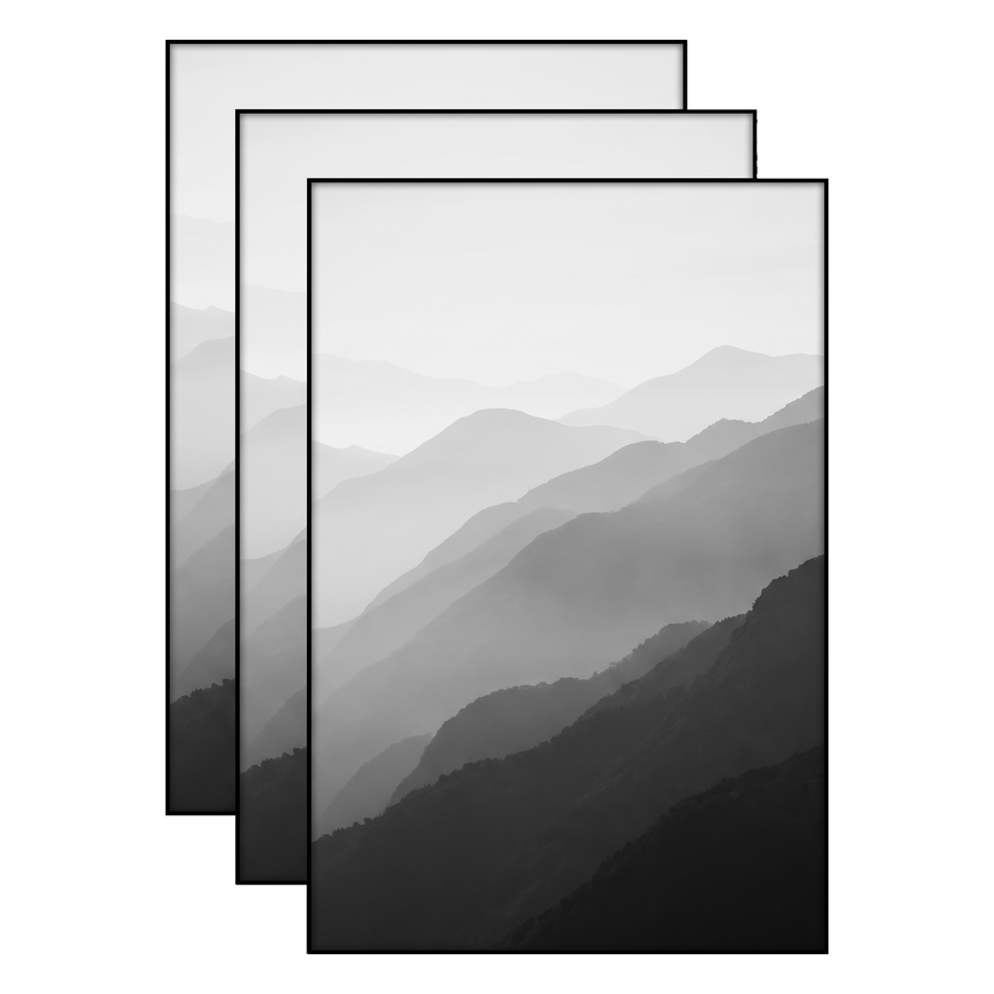 Three black 12x18 frames stacked, layered mountain ridges fading into mist 
