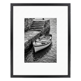 Black Brooklyn frame with a white mat, holding a photo of a rowing boat by stone steps 