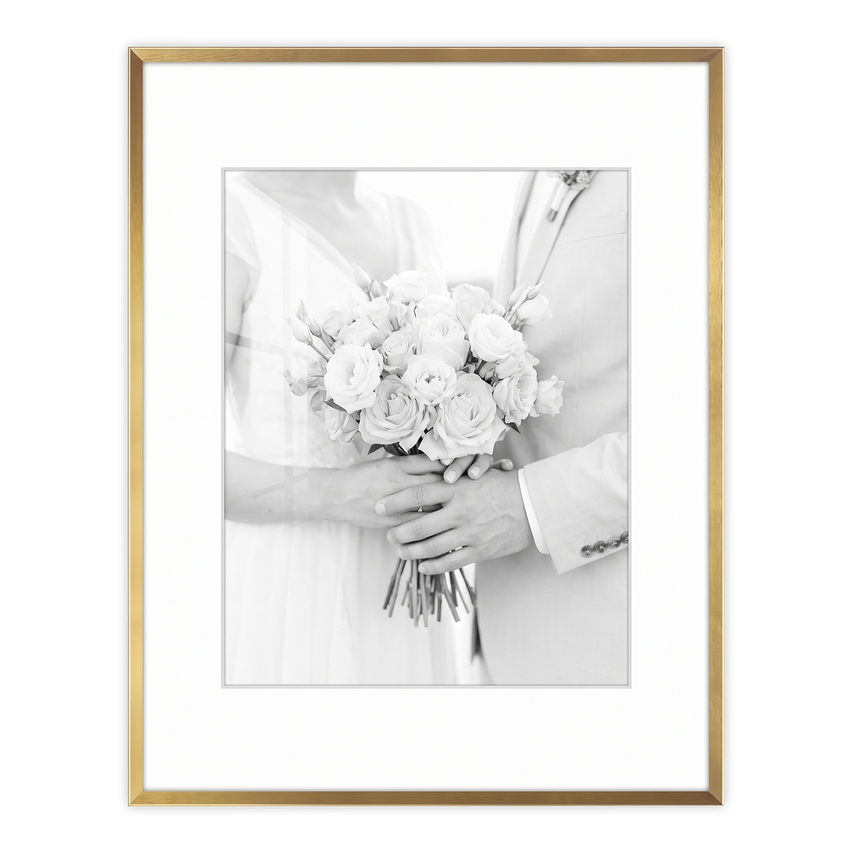 Gold Brooklyn frame with a white mat, holding a photo of a bride holding a bouquet 