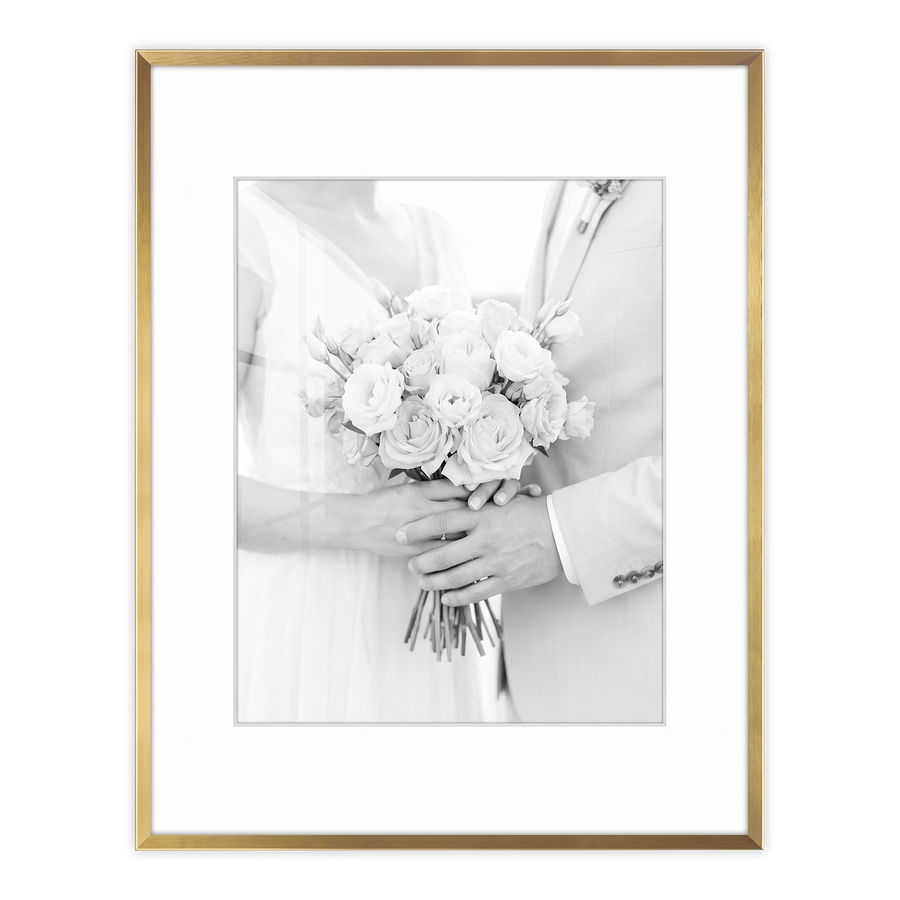 Gold Brooklyn frame with a white mat, holding a photo of a bride holding a bouquet #flat