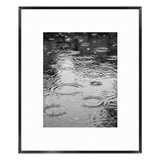 Black Brooklyn frame with a white mat, holding a photo of raindrops rippling on water 