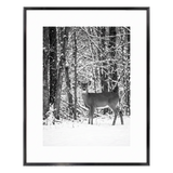 Black Brooklyn frame with a white mat, holding a photo of a deer in snowy woodland 