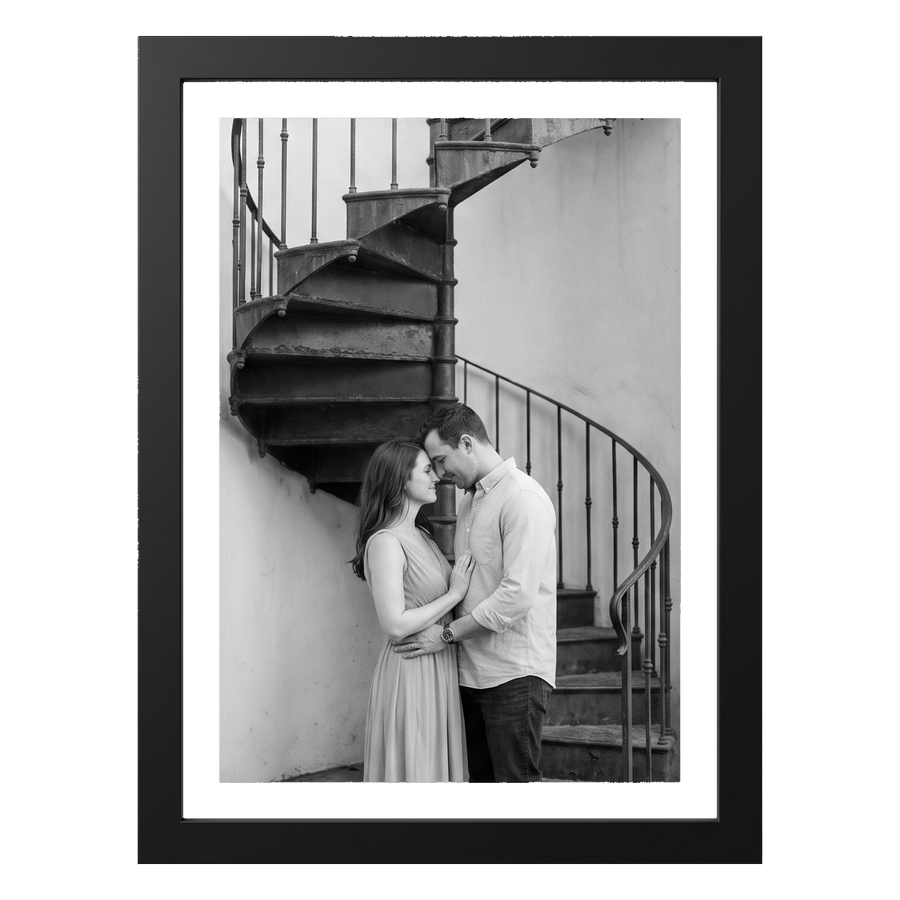Black 5x7 aluminium float frame, a black-and-white photo of a couple by a spiral staircase #flat