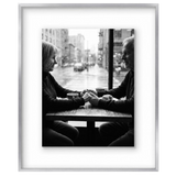 Polished nickel 16x20 float frame, a black-and-white photo of an older couple at a cafe window 