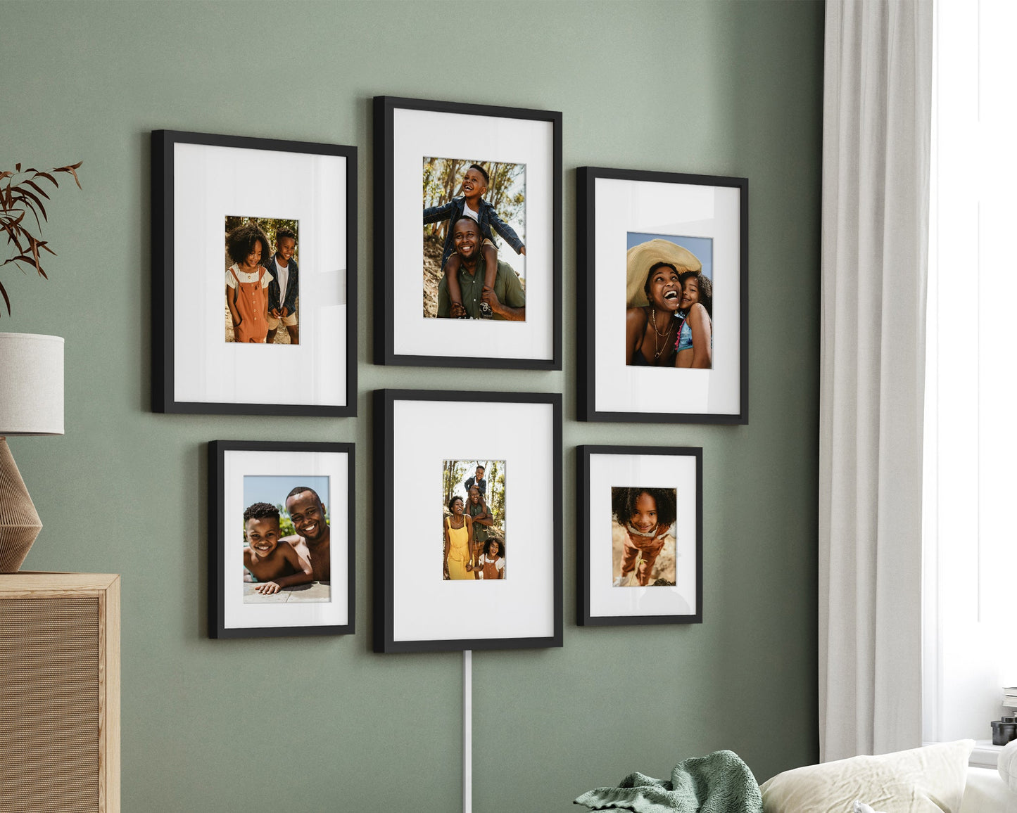Wall with framed photos in a living room setting