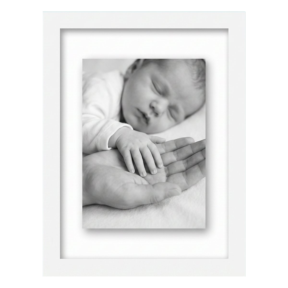 White 8.5x11 float frame, a newborn's hand resting on an adult palm, floating on backing 