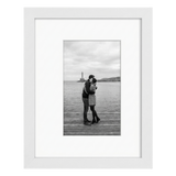 White 8x10 Soho frame, white mat opening to 5x7, a couple embracing on a waterside jetty 