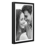 Black 12x18 Soho frame, white mat opening to 11x17, a close-up of a laughing couple 