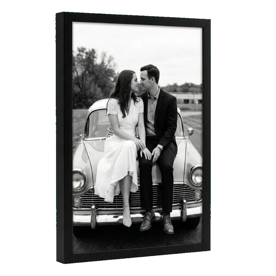 Angled black 12x18 deep frame, a couple perched on a vintage car bonnet 
