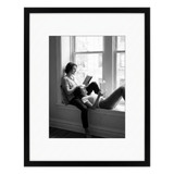 Black 16x20 Soho frame, white mat opening to 11x14, a couple reading on a window seat 