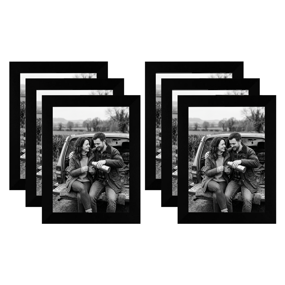 Six black 5x7 frames fanned in two stacks, a couple sitting on a car tailgate 