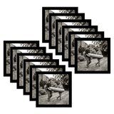 Twelve black 8x8 square frames fanned, a man carrying a bundle along a garden path 