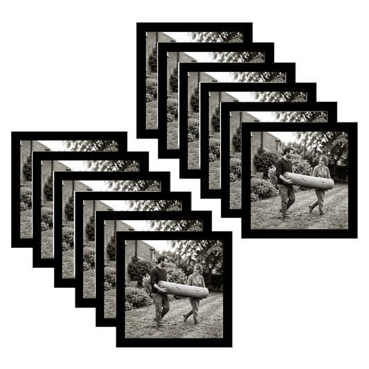 Twelve black 8x8 square frames fanned, a man carrying a bundle along a garden path #flat