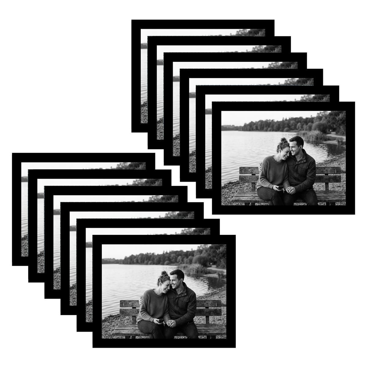Twelve black 8.5x11 landscape frames fanned, a couple on a bench by a lake 