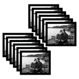 Twelve black 8.5x11 landscape frames fanned, a couple on a bench by a lake 