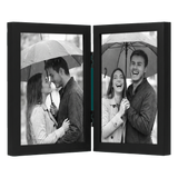 Hinged black 8x10 frame with two panels, a couple under an umbrella in the rain 