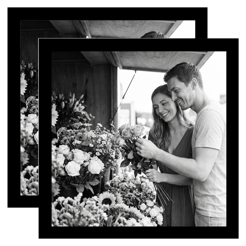 Pair of black Streamline frames, no mat, holding a photo of a couple with flowers #flat
