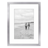 Silver Streamline frame, 6x8, with a 4x6 white mat, holding a photo of a couple on a pale beach 