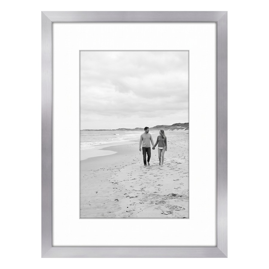 Silver Streamline frame, 6x8, with a 4x6 white mat, holding a photo of a couple on a pale beach 