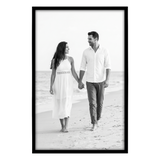 Black Streamline frame, 14x22,  no mat, holding a photo of a couple in white walking toward us 