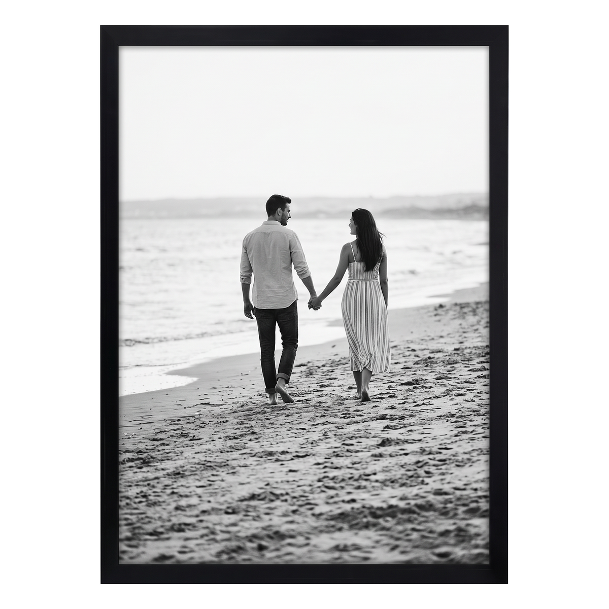 Black Streamline frame, 18x24,  no mat, holding a photo of a couple walking a wide shoreline 
