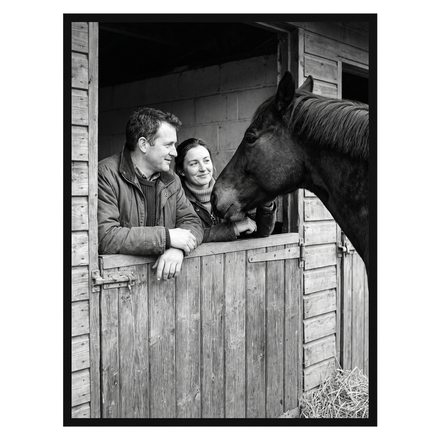 Black Streamline frame, 24x32,  no mat, holding a photo of a couple with a horse at a stable door 