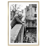 Gold Streamline frame, 28x40, with a 24x36 white mat, holding a photo of an older couple on a canal bridge 