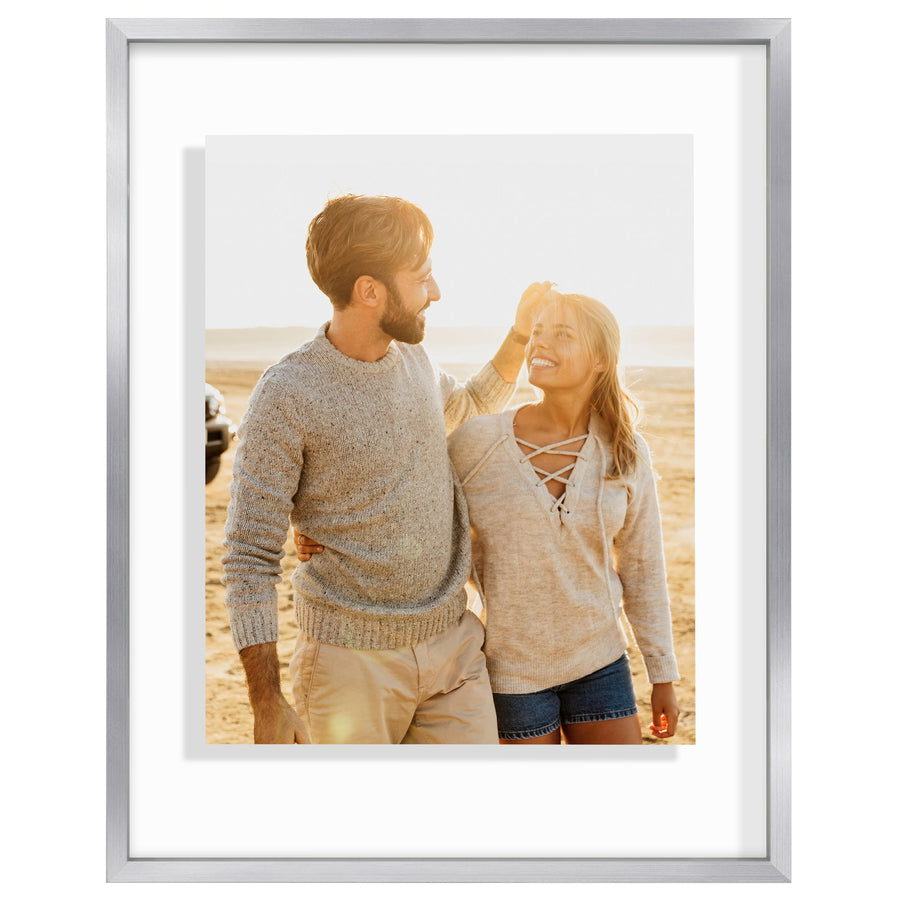 Silver 11x14 metal float frame, a couple on a beach floating clear of the white backing #flat