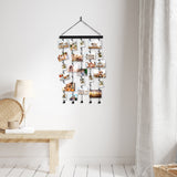 Hanging photo display on a wall above a bench with a lamp and woven basket 