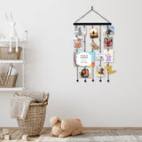 Hanging photo display on a nursery wall above baskets, holding children's pictures 