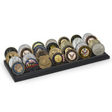 Black four-row coin display filled with military and service challenge coins 