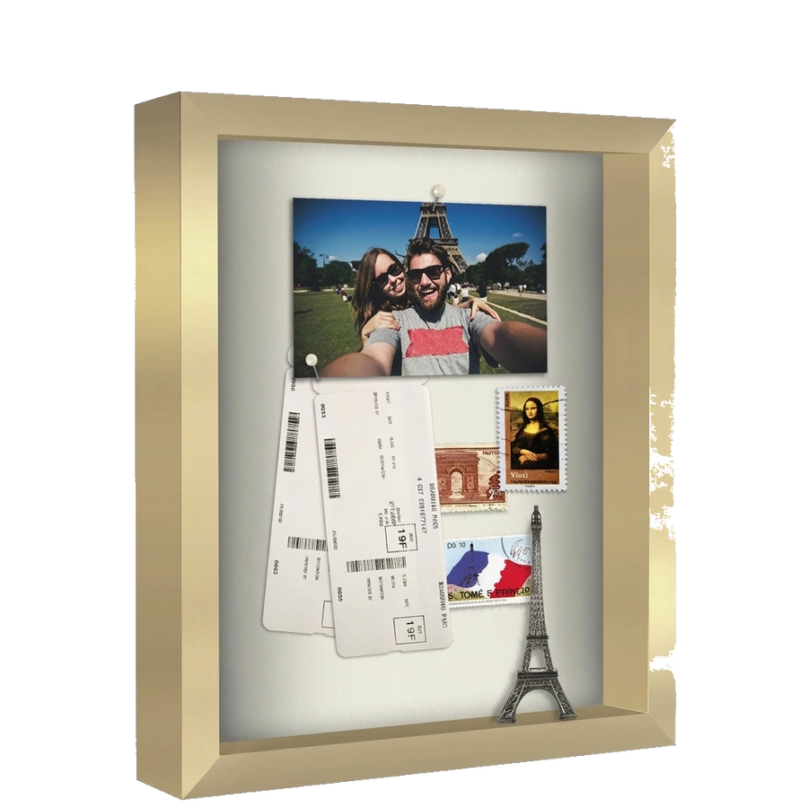 Gold 11x14 shadow box holding travel keepsakes: a photo, tickets and an Eiffel Tower model #flat