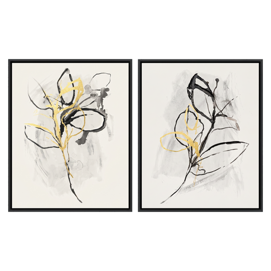 Two 16x20 canvases in slim black frames, inked botanical sprigs touched with gold #flat