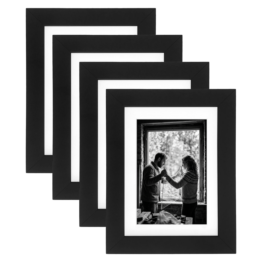 Four stacked black Signature frames with white mats, holding a photo of a couple at a window #flat